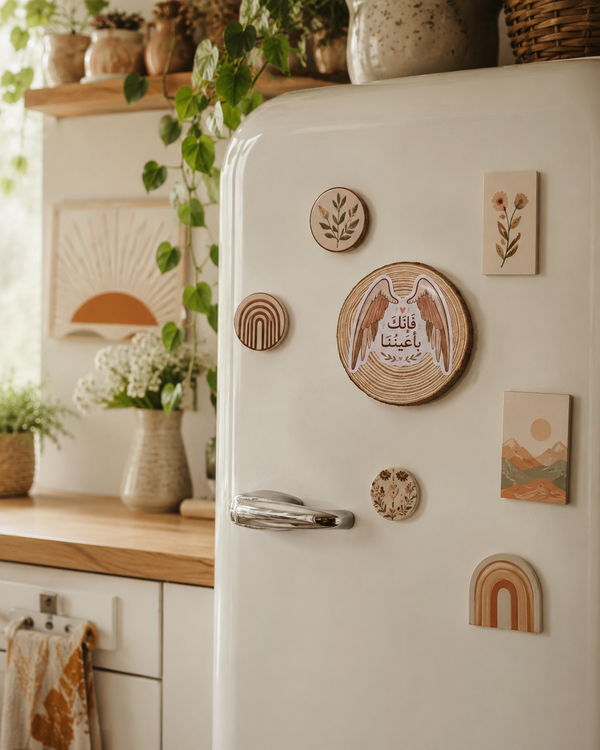 White refrigerator with decorative wooden magnets in a kitchen setting